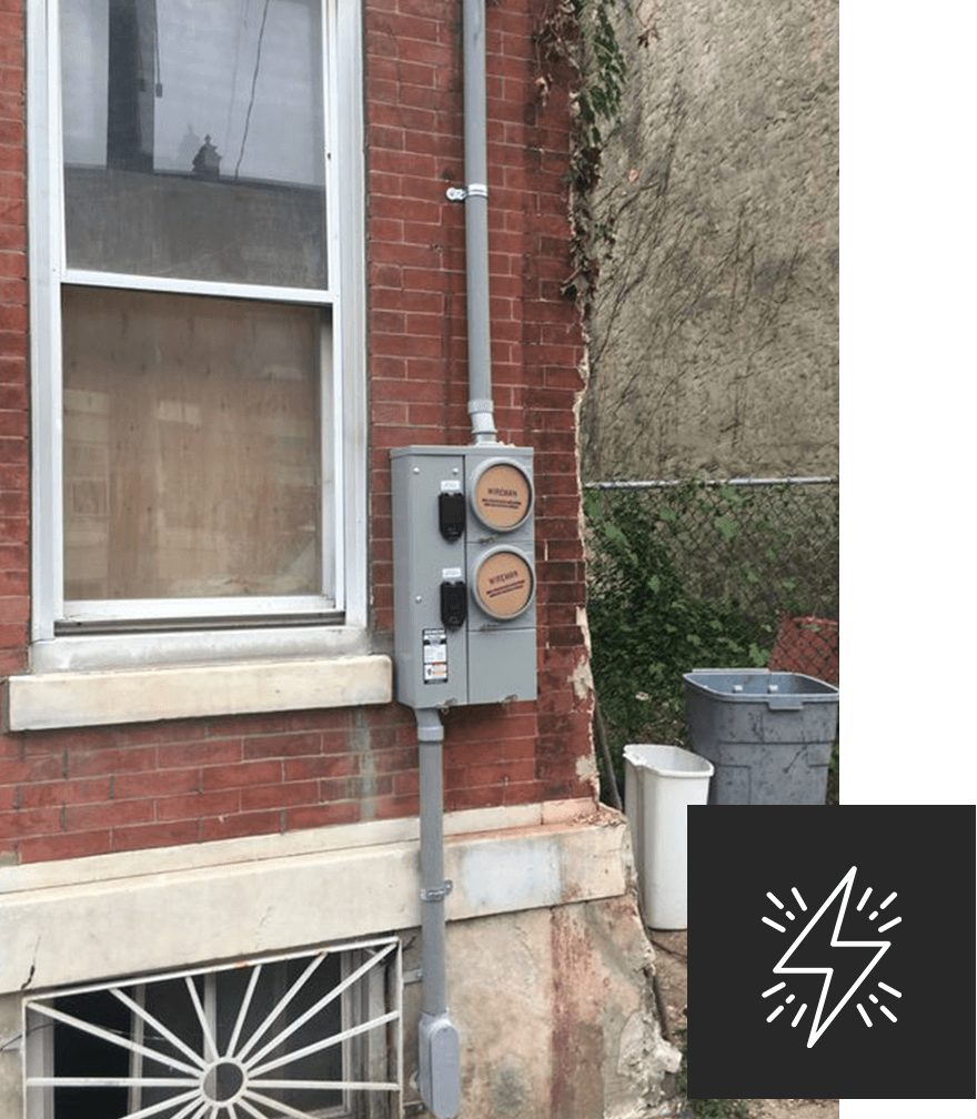 electrical utility meter on house exterior siding.