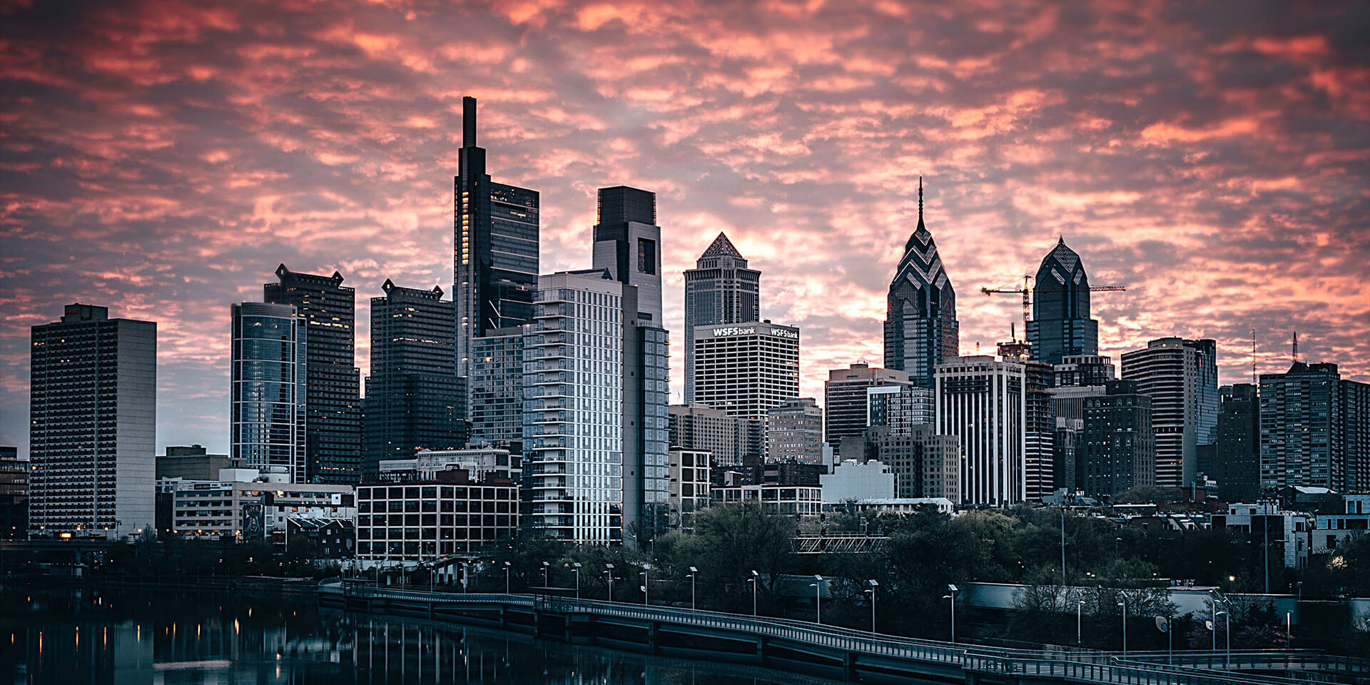 Beautiful golden sunset casting shadows over large buildings